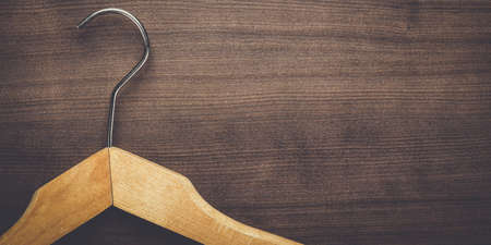 clothing hanger on the brown wooden tableの写真素材