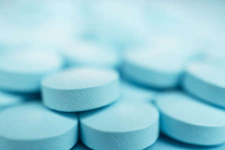 macro shot of blue pills on the background. shallow depth of fieldの写真素材