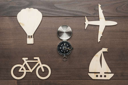 different means of transport made of wood on the table. traveling concept with copy spaceの写真素材
