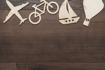 different means of transport made of wood on the table. traveling concept with copy spaceの写真素材