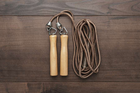 skipping rope for an exercise on the wooden tableの写真素材