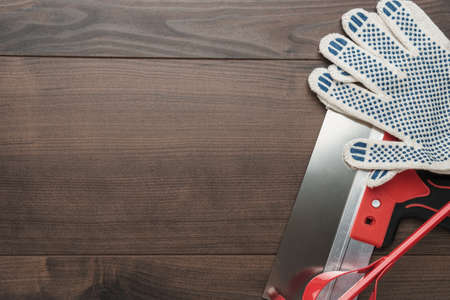 building tools for finishing work on wooden backgroundの写真素材