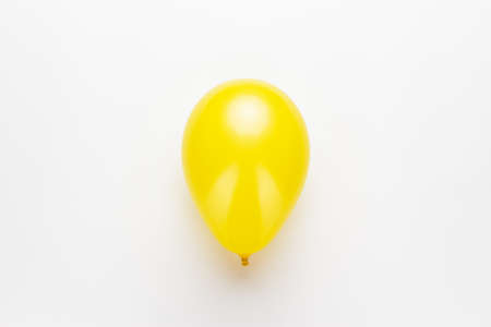 yellow balloon on the white background. not isolatedの写真素材