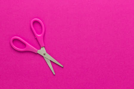 childrens scissors on the magenta background with copy spaceの写真素材