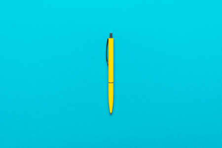 Top view of ballpoint pen on the blue
