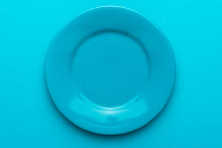 Top view photo of empty blue plate.の写真素材
