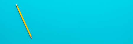 Top view of pencil on the blue background. Minimalist flat lay photo of yellow pencil over turquoise...