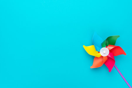 Pinwheel on turquoise blue background with copy space.