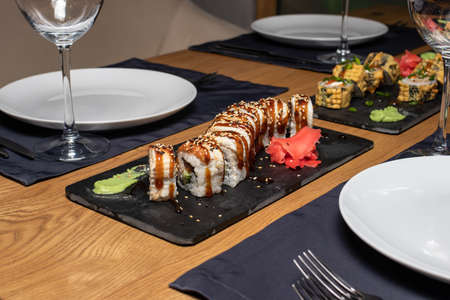 Sushi on the table in the restaurant. Served table with plates and glasses. Its a beautiful serve.の写真素材