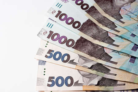Ukrainian money on a white background. A thousand and five hundred hryvnia bills
