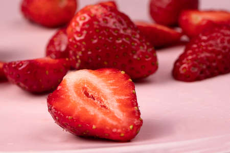 Strawberries on a pink background. Red sweet berries.の写真素材