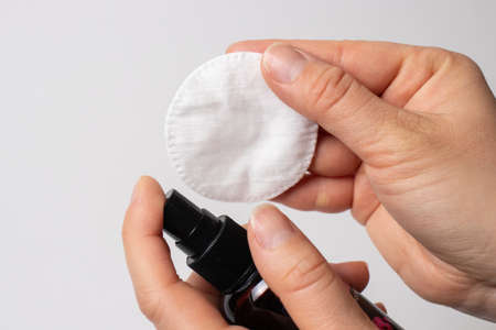 Cotton pad with tonic, micellar water for the face.