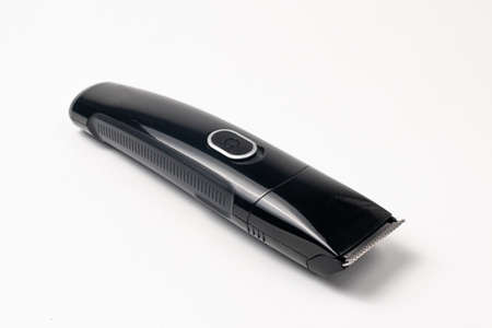 A razor with a trimmer for cutting and shaving hair, with a comb nozzle. Care for beard and hairの写真素材