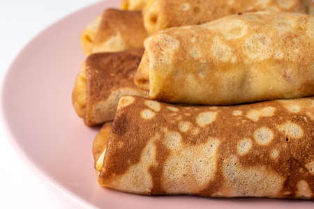 Wheat flour pancakes with strawberries. Sweet homemade pastries for breakfast. With sugar.の写真素材
