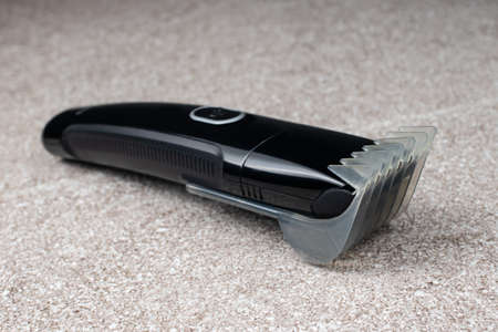 A razor with a trimmer for cutting and shaving hair, with a comb nozzle. Care for beard and hair.