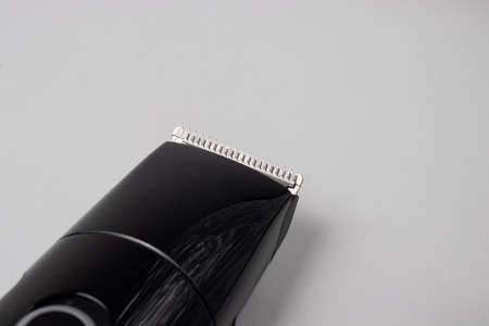 A razor with a trimmer for cutting and shaving hair, with a comb nozzle. Care for beard and hair.