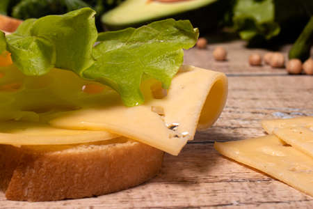 Appetizing simple sandwich with bread, cheese and lettuce.の写真素材