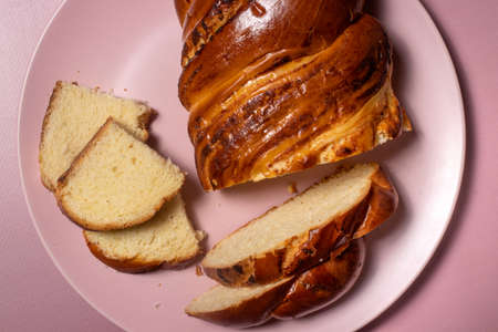 Tasty fragrant wicker bun for breakfast. Bread made from wheat flour with curd filling for the whole...