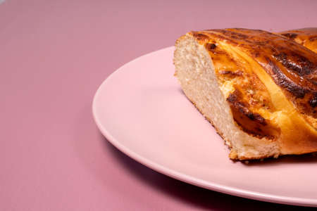 Tasty fragrant wicker bun for breakfast. Bread made from wheat flour with curd filling for the whole...