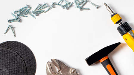 A set of construction tools and fittings for repair - hammer, screwdriver, self-cutters, cut circle....