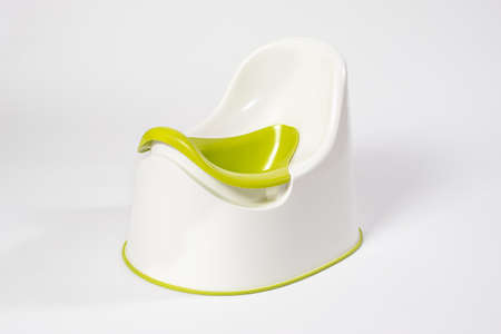 Childrens pot is white-green on a white background. Teaching a child to pot, shop childrens goods.