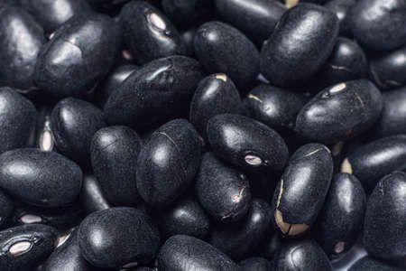 Black beans macro photo close-up top view. Legumes are a source of protein, vegetarian foods.の写真素材