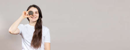 A woman with long hair holds a solid shampoo. Ecology cosmetics with natural composition. Plant shampoo, environmental theme. Banner place for textの写真素材