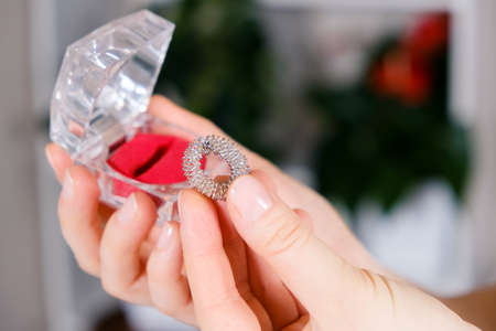 Massage ring for fingers in female hands close-up. Su Jok therapy, diagnosis and treatment of diseases, acupuncture and acupressure.の写真素材