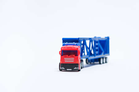 Toy car transporter with cars on a white background with place for text, copy space, for a toy store.の写真素材