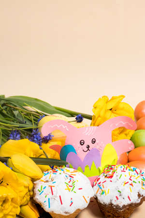Beautiful Easter vertical card with rabbit paper craft and cakes, place for text