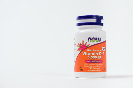A jar of vitamin D3 pills on a white background with space for text. Vitamins for people. 19 May 2022, Ukraine, Zaporozhyeのeditorial素材