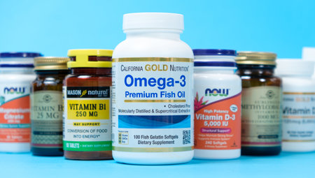 A lot of jars with dietary supplements on a blue background, a long banner. 19 May 2022, Ukraine, Zaporozhyeのeditorial素材