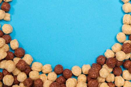 Corn sweet balls on a blue background with place for text. Quick breakfasts, top viewの写真素材