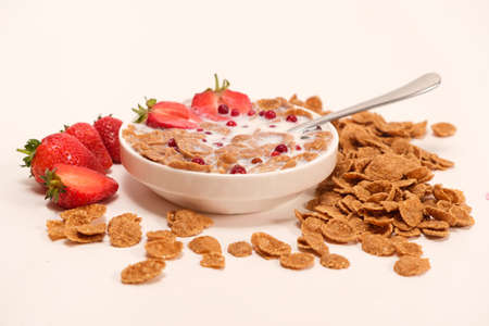 Cereals drenched in milk - quick breakfast with fruits and berries.