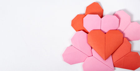 Origami for Valentines Day - hearts made of paper on a white background do it yourself