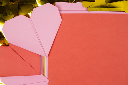 Origami pink and red hearts with sheet of paper place for text, Valentines Day