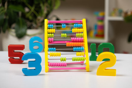 Colorful childrens abacus on the table. Mathematics, arithmetic for preschool and school children, learning to countの写真素材