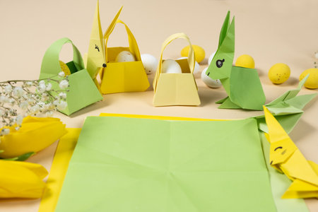 Handicrafts from paper for Easter - origami, making figurines of Easter bunnies and baskets, place for textの写真素材
