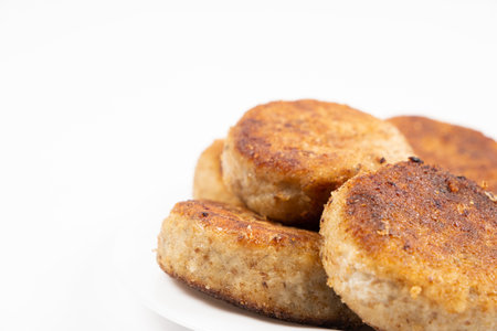 Fried homemade fish cutlets on a white background, close-up, recipe for fish cutlets, copy the place...