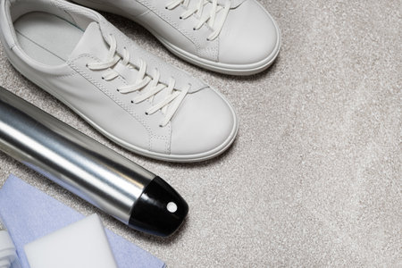 White leather shoe cleaning kit - water-repellent spray, foam, rag and sponge, copy space, place for text.の写真素材