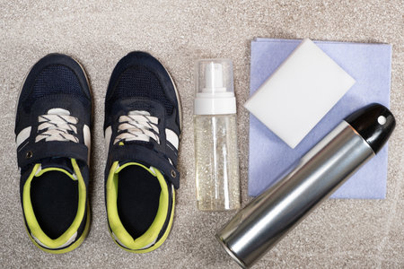 Set for cleaning children's shoes, sneakers - foam, water-repellent spray, sponge and ragの写真素材
