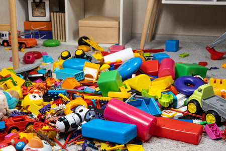 An abundance of toys in the childrens room, a lot of plastic multi-colored parts from designers, spare parts for toys, figurines and cubes.の写真素材