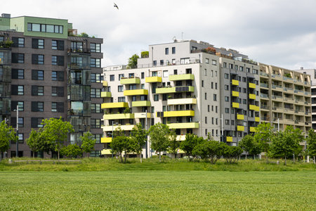 Cozy district of Vienna in Austria - new modern colorful European multi-story houses among trees.の写真素材