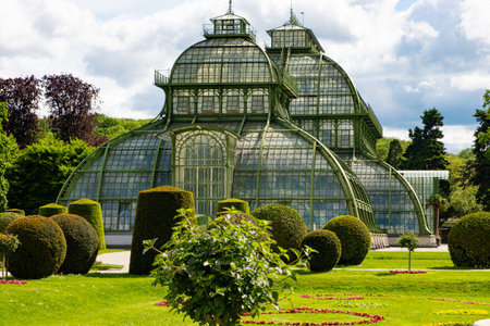 Greenhouse Palm House, Palmenhaus at Schonbrunn garden, historic glass building. May 15, 2023, Austria, Vienna.のeditorial素材