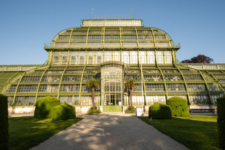 Greenhouse Palm House, Palmenhaus at Schonbrunn garden, historic glass building. May 15, 2023, Austria, Vienna.のeditorial素材