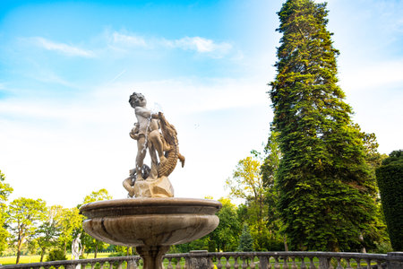 Fountain in the form of a sculpture of a boy and a crocodile in Vienna in Austria. 20 May 2023, Austria, Viennaのeditorial素材