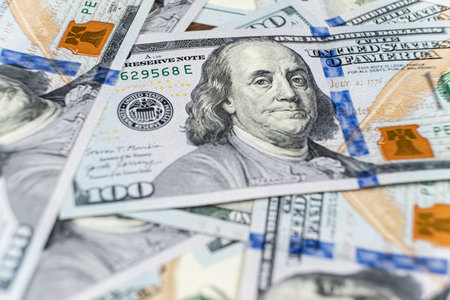 A lot of 100 dollar bills close-up macro
