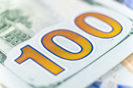 A lot of 100 dollar bills close-up macro.