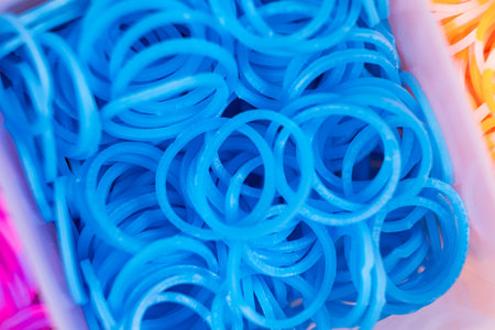 A set of blue elastic bands for weaving bracelets for children