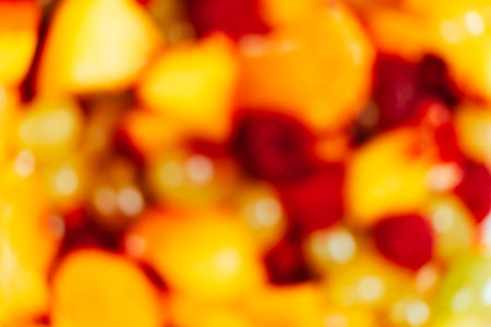 Fruit salad with sliced fruit, mixed grapes, raspberries, nectarines, tangerines and apples.の写真素材